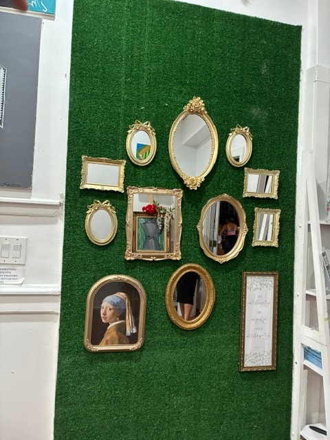 Art Escape Popup Store, Bronx, NY — gold-framed gallery wall. Photography by Wanda Jones-Lopez.