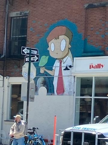 Cartoon boy street mural on a brick building, Brooklyn, NYC. Photography by Wanda Jones-Lopez.